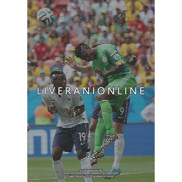 (140630) -- BRASILIA, June 30, 2014 () -- Nigeria\'s Joseph Yobo jumps for the ball during a Round of 16 match between France and Nigeria of 2014 FIFA World Cup at the Estadio Nacional Stadium in Brasilia, Brazil, on June 30, 2014. (/Li Ming)(rh) ©photoshot/Agenzia Aldo Liverani sas - ITALY ONLY - EDITORIAL USE ONLY - Francia v Nigeria Coppa del Mondo FIFA 2014 Nacional stadio Estadio in Brasilia, Brasile, 30 giugno 2014