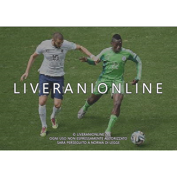 (140630) -- BRASILIA, June 30, 2014 () -- France\'s Karim Benzema vies with Nigeria\'s Kenneth Omeruo during a Round of 16 match between France and Nigeria of 2014 FIFA World Cup at the Estadio Nacional Stadium in Brasilia, Brazil, on June 30, 2014. (/Liu Dawei)(rh) ©photoshot/Agenzia Aldo Liverani sas - ITALY ONLY - EDITORIAL USE ONLY - Francia v Nigeria Coppa del Mondo FIFA 2014 Nacional stadio Estadio in Brasilia, Brasile, 30 giugno 2014