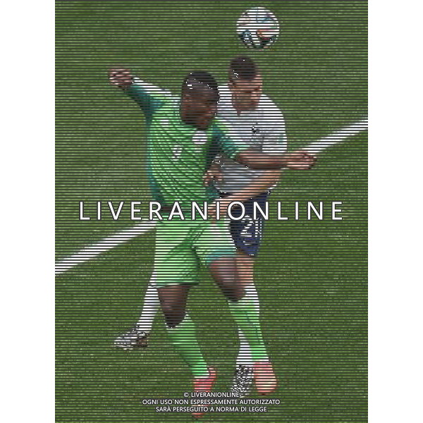 (140630) -- BRASILIA, June 30, 2014 () -- France\'s Laurent Koscielny vies with Nigeria\'s Emmanuel Emenike during a Round of 16 match between France and Nigeria of 2014 FIFA World Cup at the Estadio Nacional Stadium in Brasilia, Brazil, on June 30, 2014. (/Liu Dawei)(rh) ©photoshot/Agenzia Aldo Liverani sas - ITALY ONLY - EDITORIAL USE ONLY - Francia v Nigeria Coppa del Mondo FIFA 2014 Nacional stadio Estadio in Brasilia, Brasile, 30 giugno 2014