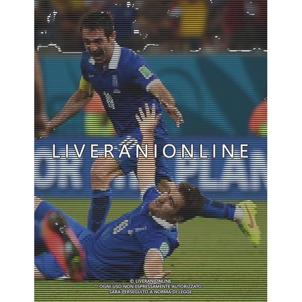(140629) -- RECIFE, June 29, 2014 () -- Greece\'s Sokratis Papastathopoulos (up) celebrates the goal during a Round of 16 match between Costa Rica and Greece of 2014 FIFA World Cup at the Arena Pernambuco Stadium in Recife, Brazil, on June 29, 2014.(/Guo Yong)(rh) ©photoshot/Agenzia Aldo Liverani sas - ITALY ONLY - EDITORIAL USE ONLY - Costa Rica Vs Grecia Coppa del mondo FIFA 2014 allo stadio Arena Pernambuco di Recife, in Brasile, il 29 giugno 2014