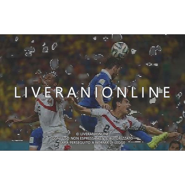 (140629) -- RECIFE, June 29, 2014 () -- Greece\'s Kostas Katsouranis (C) jumps for the ball during a Round of 16 match between Costa Rica and Greece of 2014 FIFA World Cup at the Arena Pernambuco Stadium in Recife, Brazil, on June 29, 2014.(/Guo Yong)(rh) ©photoshot/Agenzia Aldo Liverani sas - ITALY ONLY - EDITORIAL USE ONLY - Costa Rica Vs Grecia Coppa del mondo FIFA 2014 allo stadio Arena Pernambuco di Recife, in Brasile, il 29 giugno 2014