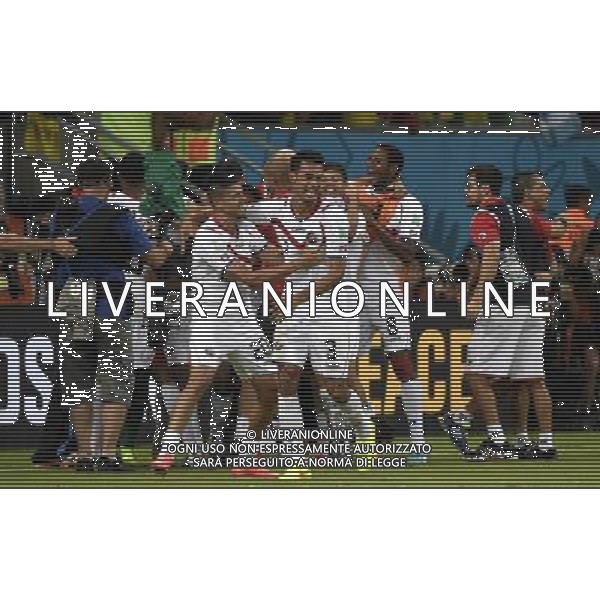 (140629) -- RECIFE, June 29, 2014 () -- Costa Rica\'s Diego Calvo (L, front) and Giancarlo Gonzalez (R, front) celebrate their victory after the penalty shoot-out of a Round of 16 match between Costa Rica and Greece of 2014 FIFA World Cup at the Arena Pernambuco Stadium in Recife, Brazil, on June 29, 2014. Costa Rica won 6-4 (5-3 in penalties) over Greece and qualified for quarter-finals on Sunday. (/Lui Siu Wai)(pcy) ©photoshot/Agenzia Aldo Liverani sas - ITALY ONLY - EDITORIAL USE ONLY - Costa Rica Vs Grecia Coppa del mondo FIFA 2014 allo stadio Arena Pernambuco di Recife, in Brasile, il 29 giugno 2014