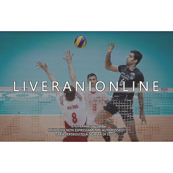 (140630) -- TEHRAN, June 30, 2014 () -- Mohammad Mousavi (R) of Iran spikes the ball during the match against Poland at FIVB Men\'s Volleyball World League 2014 at Azadi Stadium in Tehran, Iran on June 29, 2014. Iran won 3-0. (/Ahmad Halabisaz) ©photoshot/Agenzia Aldo Liverani sas - ITALY ONLY - EDITORIAL USE ONLY