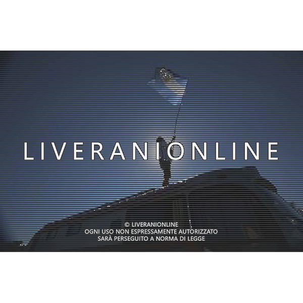 (140630) -- SAO PAULO, June 30, 2014 () -- A supporter of Argentina waves an Argentina\'s national flag at a fans camp in Sao Paulo, Brazil, on June 30, 2014, one day ahead of a Round of 16 match between Argentina and Switzerland, which is estimated to attract over 50,000 Argentina\'s fans. (/Rahel Patrasso)(pcy) ©photoshot/Agenzia Aldo Liverani sas - ITALY ONLY - EDITORIAL USE ONLY - Argentina - Svizzera Coppa del Mondo FIFA 2014 allo stadio Arena di Sao Paulo, in Brasile, 1 ° luglio 2014