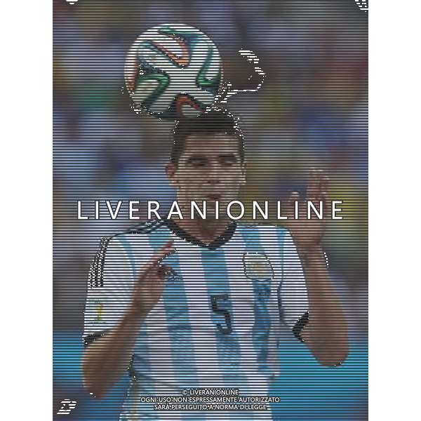 (140701) -- SAO PAULO, July 1, 2014 () -- Argentina\'s Fernando Gago jumps for a header during a Round of 16 match between Argentina and Switzerland of 2014 FIFA World Cup at the Arena de Sao Paulo Stadium in Sao Paulo, Brazil, on July 1, 2014. Argentina won 1-0 over Switzerland after 120 minutes and qualified for quarter-finals on Tuesday.(/Xu Zijian)(rh) ©photoshot/Agenzia Aldo Liverani sas - ITALY ONLY - EDITORIAL USE ONLY - Argentina - Svizzera Coppa del Mondo FIFA 2014 allo stadio Arena di Sao Paulo, in Brasile, 1 ° luglio 2014
