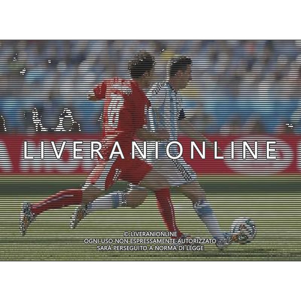 (140701) -- SAO PAULO, July 1, 2014 () -- Switzerland\'s Admir Mehmedi (L) vies with Argentina\'s Lionel Messi during a Round of 16 match between Argentina and Switzerland of 2014 FIFA World Cup at the Arena de Sao Paulo Stadium in Sao Paulo, Brazil, on July 1, 2014.(/Wang Lili)(pcy) ©photoshot/Agenzia Aldo Liverani sas - ITALY ONLY - EDITORIAL USE ONLY - Argentina - Svizzera Coppa del Mondo FIFA 2014 allo stadio Arena di Sao Paulo, in Brasile, 1 ° luglio 2014