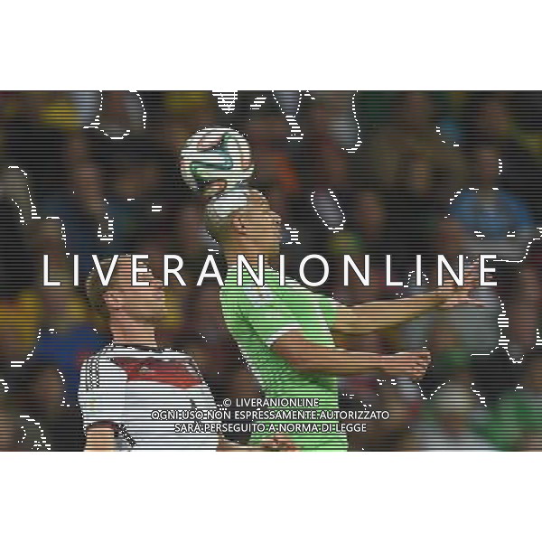 (140630) -- PORTO ALEGRE, June 30, 2014 (Xinhua) -- Germany\'s Benedikt Howedes (L) competes for a header with Algeria\'s Sofiane Feghouli during a Round of 16 match between Germany and Algeria of 2014 FIFA World Cup at the Estadio Beira-Rio Stadium in Porto Alegre, Brazil, on June 30, 2014. (Xinhua/Li Ga)(pcy) ©photoshot/Agenzia Aldo Liverani sas - ITALY ONLY - EDITORIAL USE ONLY