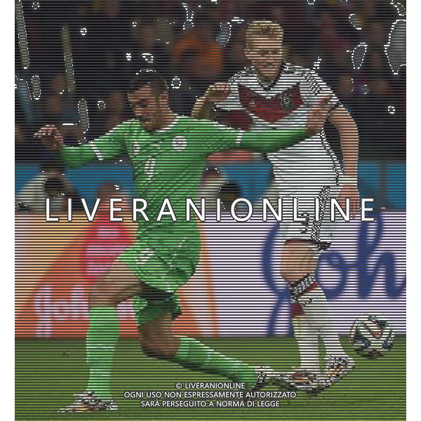 (140630) -- PORTO ALEGRE, June 30, 2014 () -- Algeria\'s Essaid Belkalem (L) vies with Germany\'s Andre Schurrle during a Round of 16 match between Germany and Algeria of 2014 FIFA World Cup at the Estadio Beira-Rio Stadium in Porto Alegre, Brazil, on June 30, 2014. Germany won 2-1 over Algeria after 120 minutes and qualified for quarter-finals on Monday. (/Li Ga)(pcy) ©photoshot/Agenzia Aldo Liverani sas - ITALY ONLY - EDITORIAL USE ONLY