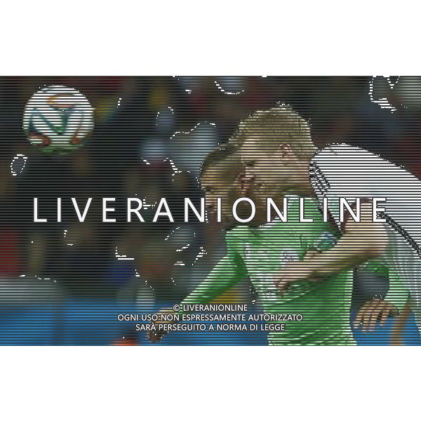 (140630) -- PORTO ALEGRE, June 30, 2014 () -- Germany\'s Per Mertesacker) vies with Algeria\'s Islam Slimani during a Round of 16 match between Germany and Algeria of 2014 FIFA World Cup at the Estadio Beira-Rio Stadium in Porto Alegre, Brazil, on June 30, 2014. Germany won 2-1 over Algeria after 120 minutes and qualified for quarter-finals on Monday. (/Chen Jianli)(rh) ©photoshot/Agenzia Aldo Liverani sas - ITALY ONLY - EDITORIAL USE ONLY