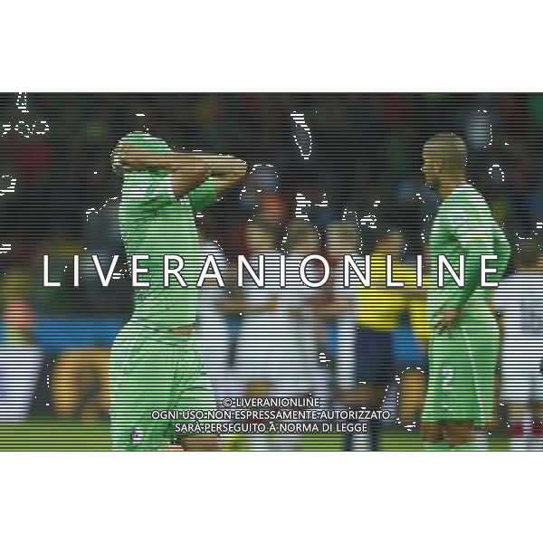 (140630) -- PORTO ALEGRE, June 30, 2014 () -- Algeria\'s Sofiane Feghouli (L) reacts after a Round of 16 match between Germany and Algeria of 2014 FIFA World Cup at the Estadio Beira-Rio Stadium in Porto Alegre, Brazil, on June 30, 2014. Germany won 2-1 over Algeria after 120 minutes and qualified for quarter-finals on Monday. (/Chen Jianli)(rh) ©photoshot/Agenzia Aldo Liverani sas - ITALY ONLY - EDITORIAL USE ONLY