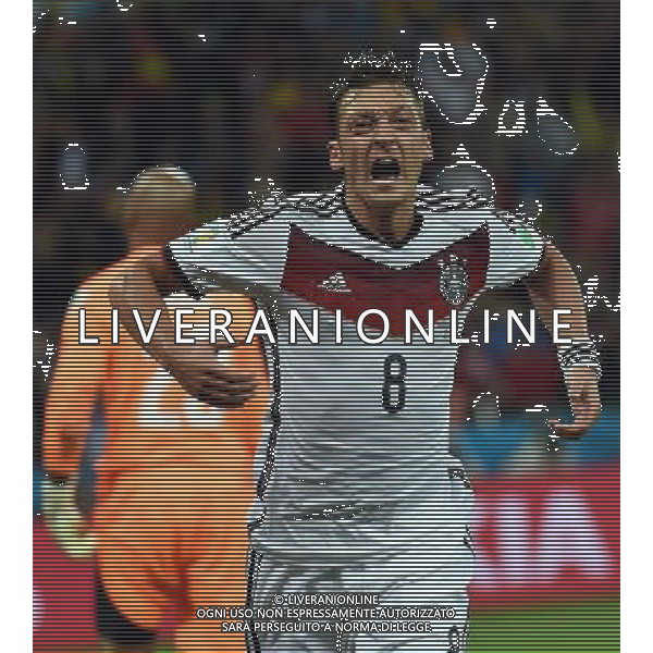 (140630) -- PORTO ALEGRE, June 30, 2014 () -- Germany\'s Mesut Ozil celebrates a goal during the extra time of a Round of 16 match between Germany and Algeria of 2014 FIFA World Cup at the Estadio Beira-Rio Stadium in Porto Alegre, Brazil, on June 30, 2014. Germany won 2-1 over Algeria after 120 minutes and qualified for quarter-finals on Monday. (/Li Ga)(pcy) ©photoshot/Agenzia Aldo Liverani sas - ITALY ONLY - EDITORIAL USE ONLY