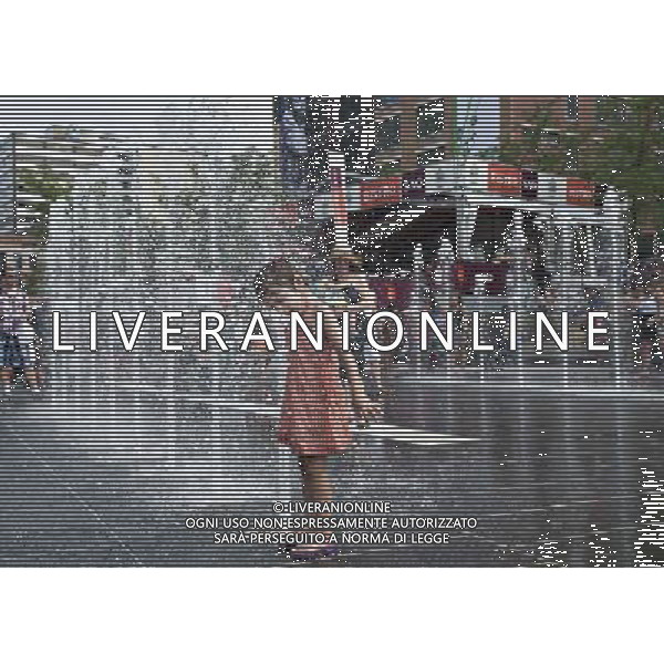 (140702) -- MONTREAL, July 2, 2014 () -- A girl plays with water at a fountain in Montreal, Canada, July 1, 2014. The Montreal International Jazz Festival becomes family oriented during the days of its operation offering kid friendly activities including street performers as well as the Centre du Spectacle converting to a water park for kids of all ages to beat the sweltering summer in Montreal. (/Andrew Soong) ©PHOTOSHOT/Agenzia Aldo Liverani sas - ITALY ONLY - EDITORIAL USE ONLY