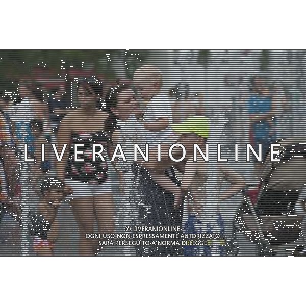 (140702) -- MONTREAL, July 2, 2014 () -- Local citizens are see near a water fountain in Montreal, Canada, July 1, 2014. The Montreal International Jazz Festival becomes family oriented during the days of its operation offering kid friendly activities including street performers as well as the Centre du Spectacle converting to a water park for kids of all ages to beat the sweltering summer in Montreal. (/Andrew Soong) ©PHOTOSHOT/Agenzia Aldo Liverani sas - ITALY ONLY - EDITORIAL USE ONLY