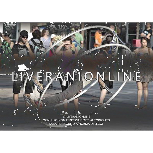 (140702) -- MONTREAL, July 2, 2014 () -- An acrobat performs in the street of Montreal, Canada, July 1, 2014. The Montreal International Jazz Festival becomes family oriented during the days of its operation offering kid friendly activities including street performers as well as the Centre du Spectacle converting to a water park for kids of all ages to beat the sweltering summer in Montreal. (/Andrew Soong) ©PHOTOSHOT/Agenzia Aldo Liverani sas - ITALY ONLY - EDITORIAL USE ONLY