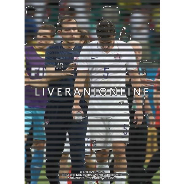 (140701) -- SALVADOR, July 1, 2014 () -- Matt Besler (R) of the U.S. reacts after a Round of 16 match between Belgium and the U.S. of 2014 FIFA World Cup at the Arena Fonte Nova Stadium in Salvador, Brazil, on July 1, 2014. Belgium won 2-1 over the U.S. after 120 minutes and qualified for quarter-finals on Tuesday.(/Cao Can) AG ALDO LIVERANI SAS ONLY ITALY