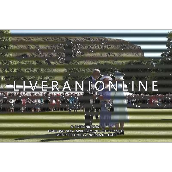 Queen Elizabeth II speaks to guests as she hosts a garden party with Arthur Seat in the background at the Palace of Holyrood house in Edinburgh. ©PHOTOSHOT /Agenzia Aldo Liverani sas - ITALY ONLY - EDITORIAL USE ONLY