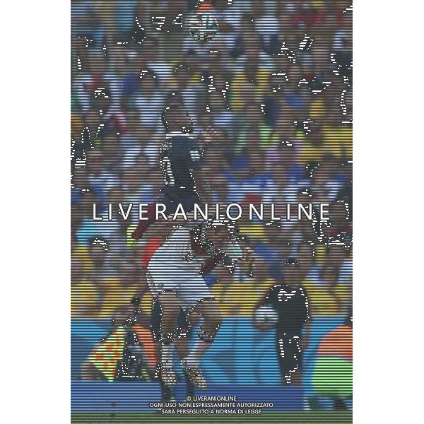 (140704) -- RIO DE JANEIRO, July 4, 2014 () -- France\'s Patrice Evra (up) jumps for a header during a quarter-finals match between France and Germany of 2014 FIFA World Cup at the Estadio do Maracana Stadium in Rio de Janeiro, Brazil, on July 4, 2014. Germany won 1-0 over France and qualified for semi-finals on Friday.(/Xu Zijian)(rh) AG ALDO LIVERANI SAS ONLY ITALY