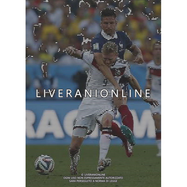 (140704) -- RIO DE JANEIRO, July 4, 2014 () -- France\'s Olivier Giroud vies with Germany\'s Andre Schuerrle during a quarter-finals match between France and Germany of 2014 FIFA World Cup at the Estadio do Maracana Stadium in Rio de Janeiro, Brazil, on July 4, 2014. Germany won 1-0 over France and qualified for semi-finals on Friday.(/Wang Lili)(rh) AG ALDO LIVERANI SAS ONLY ITALY