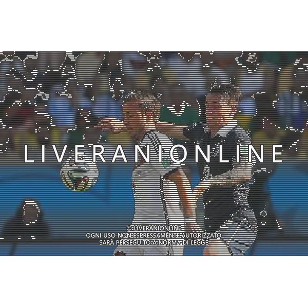 (140704) -- RIO DE JANEIRO, July 4, 2014 () -- France\'s Mathieu Debuchy vies with Germany\'s Mario Gotze during a quarter-finals match between France and Germany of 2014 FIFA World Cup at the Estadio do Maracana Stadium in Rio de Janeiro, Brazil, on July 4, 2014. Germany won 1-0 over France and qualified for semi-finals on Friday.(/Xu Zijian)(rh) AG ALDO LIVERANI SAS ONLY ITALY