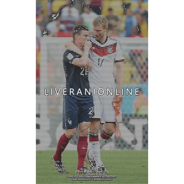 (140704) -- RIO DE JANEIRO, July 4, 2014 () -- France\'s Laurent Koscielny speaks with Germany\'s Per Mertesacker after a quarter-finals match between France and Germany of 2014 FIFA World Cup at the Estadio do Maracana Stadium in Rio de Janeiro, Brazil, on July 4, 2014. Germany won 1-0 over France and qualified for semi-finals on Friday.(/Wang Yuguo)(rh) AG ALDO LIVERANI SAS ONLY ITALY