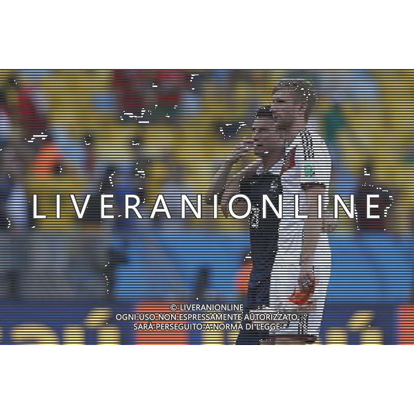 (140704) -- RIO DE JANEIRO, July 4, 2014 () -- France\'s Laurent Koscielny talks with Germany\'s Per Mertesacker after a quarter-finals match between France and Germany of 2014 FIFA World Cup at the Estadio do Maracana Stadium in Rio de Janeiro, Brazil, on July 4, 2014. Germany won 1-0 over France and qualified for semi-finals on Friday.(/Wang Lili)(rh) AG ALDO LIVERANI SAS ONLY ITALY