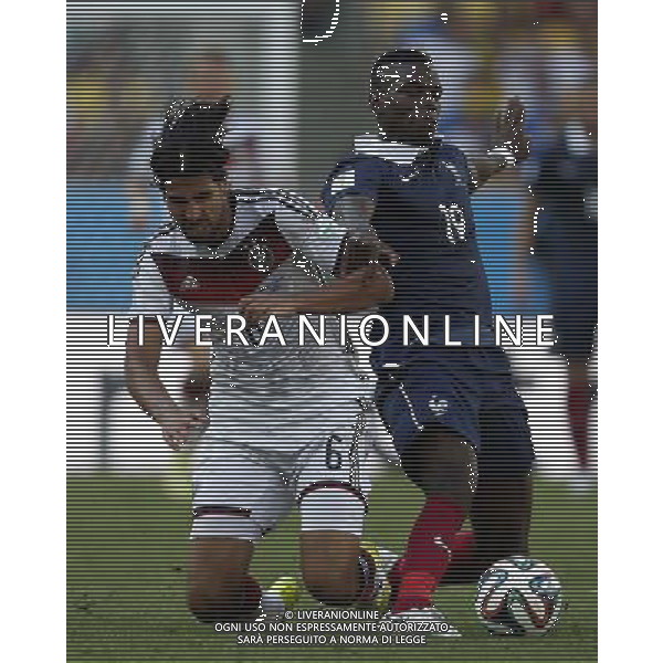 (140704) -- RIO DE JANEIRO, July 4, 2014 () -- Germany\'s Sami Khedira (L) vies with France\'s Paul Pogba during a quarter-finals match between France and Germany of 2014 FIFA World Cup at the Estadio do Maracana Stadium in Rio de Janeiro, Brazil, on July 4, 2014. Germany won 1-0 over France and qualified for semi-finals on Friday. (/Wang Lili)(pcy) AG ALDO LIVERANI SAS ONLY ITALY