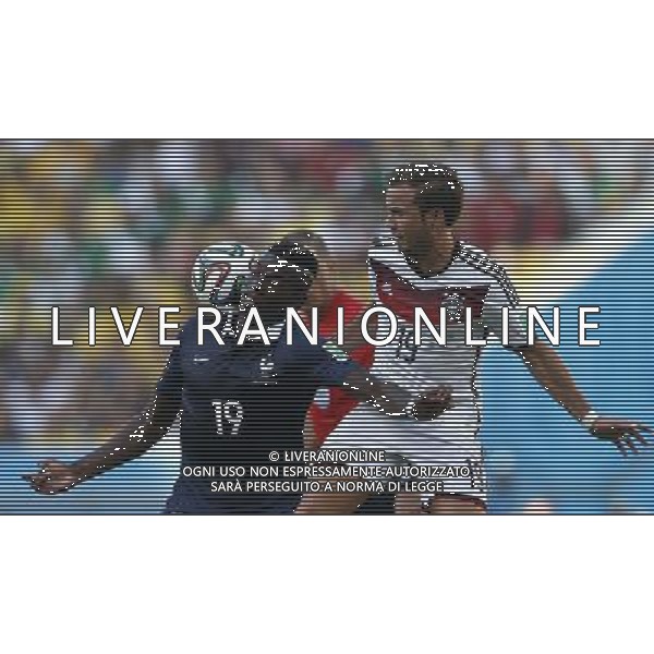 (140704) -- RIO DE JANEIRO, July 4, 2014 () -- Germany\'s Mario Gotze (R) vies with France\'s Paul Pogba during a quarter-finals match between France and Germany of 2014 FIFA World Cup at the Estadio do Maracana Stadium in Rio de Janeiro, Brazil, on July 4, 2014. Germany won 1-0 over France and qualified for semi-finals on Friday. (/Wang Lili)(pcy) AG ALDO LIVERANI SAS ONLY ITALY