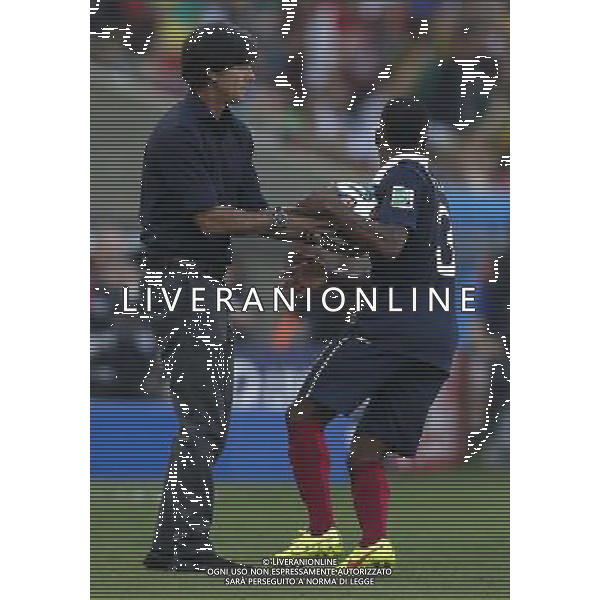 (140704) -- RIO DE JANEIRO, July 4, 2014 () -- Germany\'s coach Joachim Loew (L) gives the ball to France\'s Patrice Evra during a quarter-finals match between France and Germany of 2014 FIFA World Cup at the Estadio do Maracana Stadium in Rio de Janeiro, Brazil, on July 4, 2014.(/Wang Lili)(pcy) AG ALDO LIVERANI SAS ONLY ITALY