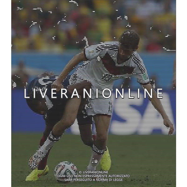 (140704) -- RIO DE JANEIRO, July 4, 2014 () -- Germany\'s Thomas Muller (R) vies with France\'s Patrice Evra during a quarter-finals match between France and Germany of 2014 FIFA World Cup at the Estadio do Maracana Stadium in Rio de Janeiro, Brazil, on July 4, 2014.(/Wang Lili)(pcy) AG ALDO LIVERANI SAS ONLY ITALY