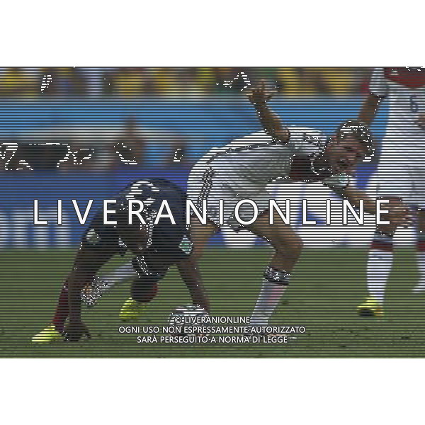 (140704) -- RIO DE JANEIRO, July 4, 2014 () -- Germany\'s Thomas Muller (R, front) vies with France\'s Patrice Evra during a quarter-finals match between France and Germany of 2014 FIFA World Cup at the Estadio do Maracana Stadium in Rio de Janeiro, Brazil, on July 4, 2014.(/Wang Lili)(pcy) AG ALDO LIVERANI SAS ONLY ITALY