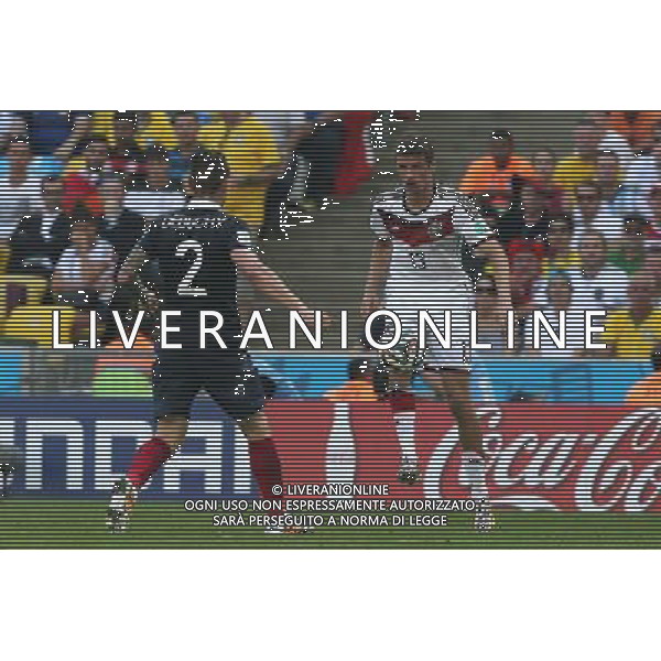 (140704) -- RIO DE JANEIRO, July 4, 2014 () -- France\'s Mathieu Debuchy vies with Germany\'s Thomas Muller during a quarter-finals match between France and Germany of 2014 FIFA World Cup at the Estadio do Maracana Stadium in Rio de Janeiro, Brazil, on July 4, 2014.(/Xu Zijian)(rh) AG ALDO LIVERANI SAS ONLY ITALY