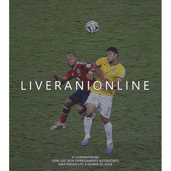 (140704) -- FORTALEZA, July 4, 2014 () -- Colombia\'s Juan Zuniga (L) vies with Brazil\'s Hulk during a quarter-finals match between Brazil and Colombia of 2014 FIFA World Cup at the Estadio Castelao Stadium in Fortaleza, Brazil, on July 4, 2014. Brazil won 2-1 over Colombia and qualified for semi-finals on Friday. (/Liao Yujie)(pcy) AG ALDO LIVERANI SAS ONLY ITALY