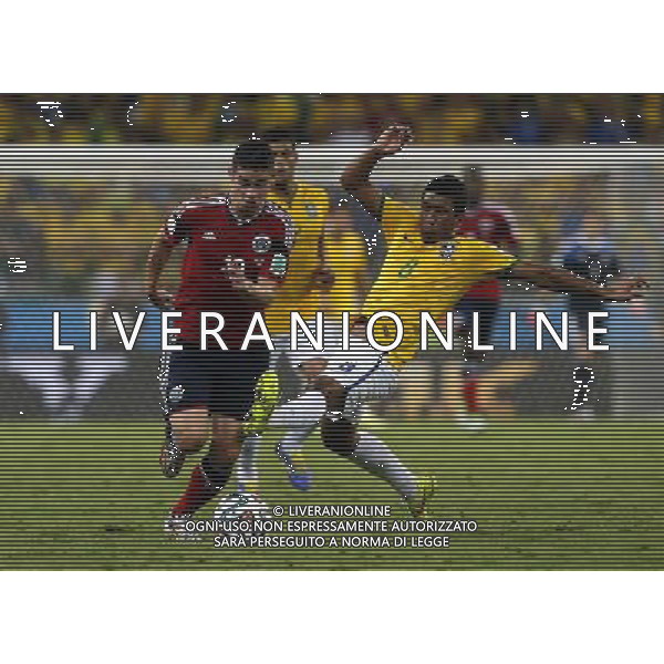 (140704) -- FORTALEZA, July 4, 2014 () -- Brazil\'s Paulinho vies with Colombia\'s James Rodriguez during a quarter-finals match between Brazil and Colombia of 2014 FIFA World Cup at the Estadio Castelao Stadium in Fortaleza, Brazil, on July 4, 2014. Brazil won 2-1 over Colombia and qualified for semi-finals on Friday. (/Zhou Lei)(rh) AG ALDO LIVERANI SAS ONLY ITALY