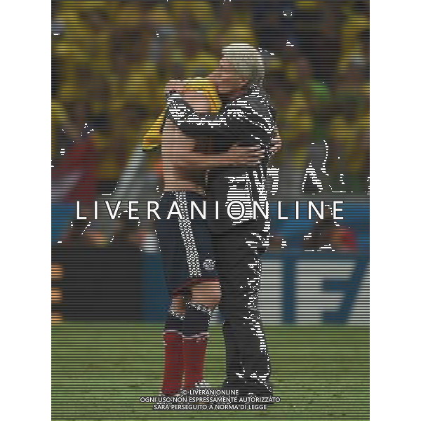 (140704) -- FORTALEZA, July 4, 2014 () -- Colombia\'s coach Jose Pekerman (R) comforts James Rodriguez after a quarter-finals match between Brazil and Colombia of 2014 FIFA World Cup at the Estadio Castelao Stadium in Fortaleza, Brazil, on July 4, 2014. Brazil won 2-1 over Colombia and qualified for semi-finals on Friday. (/Li Ga)(pcy) AG ALDO LIVERANI SAS ONLY ITALY