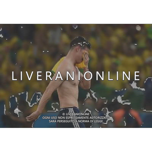 (140704) -- FORTALEZA, July 4, 2014 () -- Colombia\'s James Rodriguez leaves the field after a quarter-finals match between Brazil and Colombia of 2014 FIFA World Cup at the Estadio Castelao Stadium in Fortaleza, Brazil, on July 4, 2014. Brazil won 2-1 over Colombia and qualified for semi-finals on Friday. (/Li Ga)(pcy) AG ALDO LIVERANI SAS ONLY ITALY