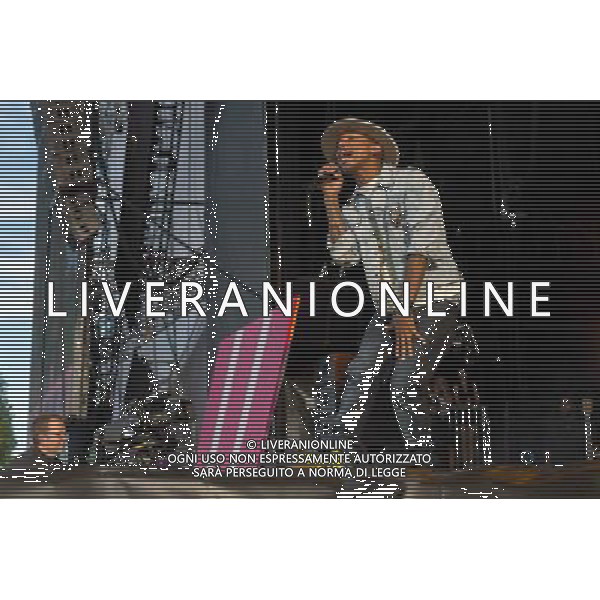 Grammy, BET Music and MTV Africa Music Award winning Pharrell Williams performing live in concert on the mains stage at Wireless 2014 LONDON, Friday, Day One at Finsbury Park, London, United Kingdom Date: 04/07/2014