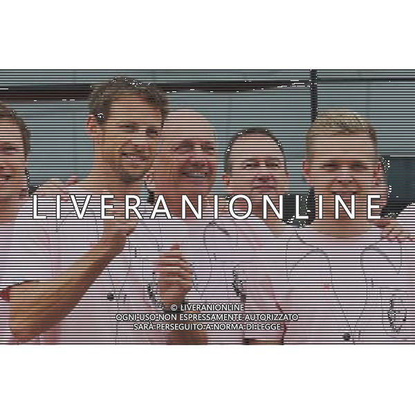 (L to R): Jenson Button (GBR) McLaren; Ron Dennis (GBR) McLaren Executive Chairman; Kevin Magnussen (DEN) McLaren; and the McLaren team wear Pink for Papa, in tribute to the late John Button (GBR). 06.07.2014. Formula 1 World Championship, Rd 9, British Grand Prix, Silverstone, England, Race Day. - www.xpbimages.com, EMail: requests@xpbimages.com - copy of publication required for printed pictures. Every used picture is fee-liable. © Copyright: Moy / XPB Images AG ALDO LIVERANI SAS ONLY ITALY