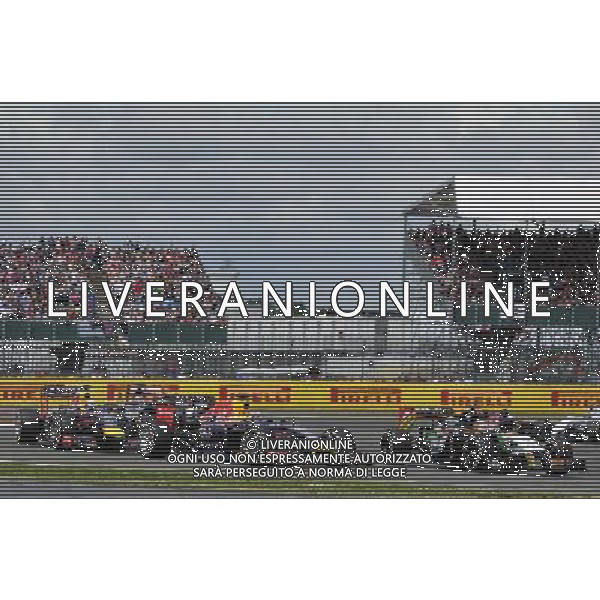 Sebastian Vettel (GER) Red Bull Racing RB10 and Nico Hulkenberg (GER) Sahara Force India F1 VJM07 at the start of the race. 06.07.2014. Formula 1 World Championship, Rd 9, British Grand Prix, Silverstone, England, Race Day. - www.xpbimages.com, EMail: requests@xpbimages.com - copy of publication required for printed pictures. Every used picture is fee-liable. © Copyright: Photo4 / XPB Images AG ALDO LIVERANI SAS ONLY ITALY