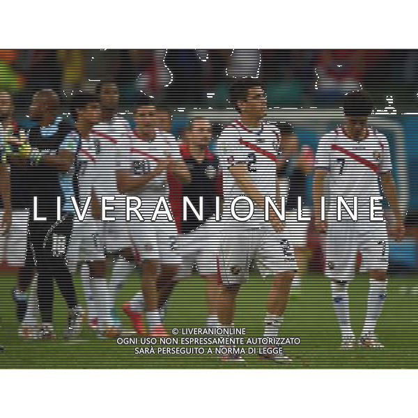 (140705) -- SALVADOR, July 5, 2014 () -- Costa Rica\'s Johnny Acosta (front) leaves the field after a quarter-finals match between Netherlands and Costa Rica of 2014 FIFA World Cup at the Arena Fonte Nova Stadium in Salvador, Brazil, on July 5, 2014. Netherlands won 4-3 on penalties over Costa Rica after a 0-0 tie and qualified for semi-finals on Saturday. (/Guo Yong)(pcy) ©photoshot/Agenzia Aldo Liverani sas - ITALY ONLY - EDITORIAL USE ONLY - Olanda vs Costa Rica partita di quarti di finale Coppa del mondo FIFA 2014 in Salvador, in Brasile, il 5 luglio 2014.