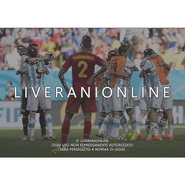 (140705) -- BRASILIA, July 5, 2014 () -- Belgium\'s Toby Alderweireld (front) reacts as Argentina\'s players celebrate their victory after a quarter-finals match between Argentina and Belgium of 2014 FIFA World Cup at the Estadio Nacional Stadium in Brasilia, Brazil, on July 5, 2014. Argentina won 1-0 over Belgium and qualified for the semi-finals. (/Qi Heng)(pcy) ©photoshot/Agenzia Aldo Liverani sas - ITALY ONLY - EDITORIAL USE ONLY - ARGENTINA VS BELGIO partita di quarti di finale Coppa del Mondo 2014 FIFA World Cup allo stadio Estadio Nacional di Brasilia, in Brasile, il 5 luglio 2014. Argentina ha vinto 1-0 contro il Belgio e si qualifica per le semifinali.