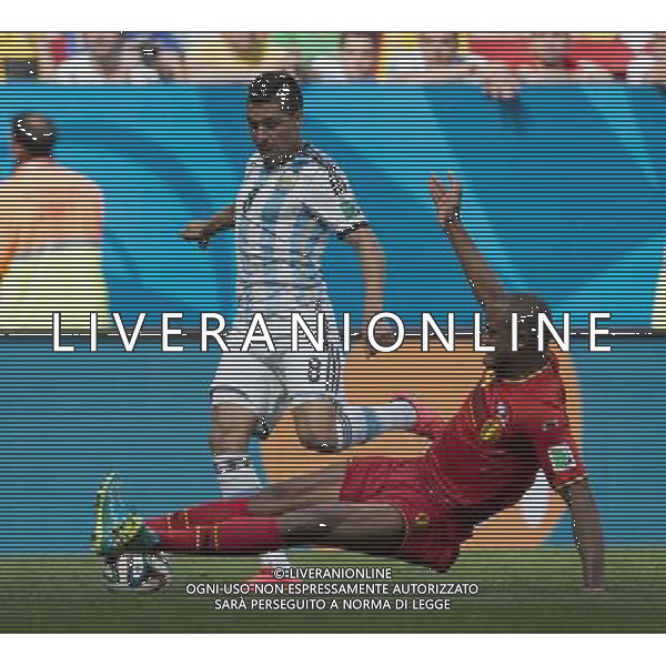 (140705) -- BRASILIA, July 5, 2014 () -- Belgium\'s Vincent Kompany (R) slide tackles the ball controlled by Argentina\'s Enzo Perez during a quarter-finals match between Argentina and Belgium of 2014 FIFA World Cup at the Estadio Nacional Stadium in Brasilia, Brazil, on July 5, 2014. Argentina won 1-0 over Belgium and qualified for the semi-finals. (/Qi Heng)(pcy) ©photoshot/Agenzia Aldo Liverani sas - ITALY ONLY - EDITORIAL USE ONLY - ARGENTINA VS BELGIO partita di quarti di finale Coppa del Mondo 2014 FIFA World Cup allo stadio Estadio Nacional di Brasilia, in Brasile, il 5 luglio 2014. Argentina ha vinto 1-0 contro il Belgio e si qualifica per le semifinali.