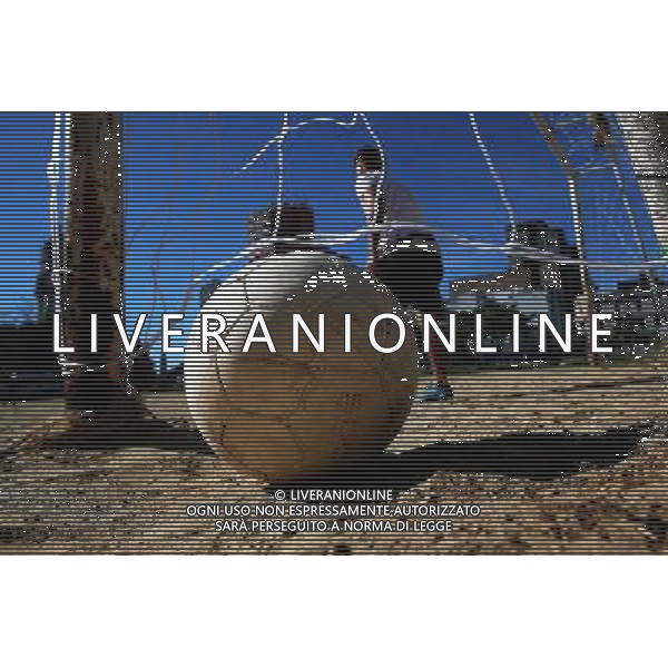 (140706) -- SAO PAULO, July 6, 2014 () -- A man participates in a match of a \'Rebel Cup\' football tournament in downtown Sao Paulo, Brazil, July 6, 2014. According to the organizer, the \'Rebel Cup\' is an informal football tournament held to protest against the \'improper\' expenditure spent by government during the preparation of World Cup 2014. (/Rahel Patrasso)(xzj) ©PHOTOSHOT/Agenzia Aldo Liverani sas - ITALY ONLY - EDITORIAL USE ONLY - Torneo di calcio informale \'Rebel Cup\' coppa Ribelle nel centro di Sao Paulo, Brasile, 6 luglio 2014 per protestare contro le spese eccessive del governo per la Coppa del Mondo FIFA 2014