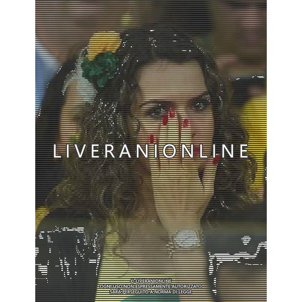 (140708) -- BELO HORIZONTE, July 8, 2014 () -- A Brazil\'s supporter wipes her tears during a semifinal match between Brazil and Germany of 2014 FIFA World Cup at the Estadio Mineirao Stadium in Belo Horizonte, Brazil, on July 8, 2014.(/Liu Dawei)(pcy) AG ALDO LIVERANI SAS ONLY ITALY