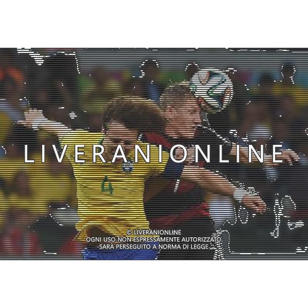 (140708) -- BELO HORIZONTE, July 8, 2014 () -- Brazil\'s David Luiz competes for a header with Germany\'s Bastian Schweinsteiger during a semifinal match between Brazil and Germany of 2014 FIFA World Cup at the Estadio Mineirao Stadium in Belo Horizonte, Brazil, on July 8, 2014.(/Li Ga)(rh) AG ALDO LIVERANI SAS ONLY ITALY