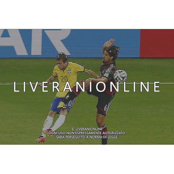 (140708) -- BELO HORIZONTE, July 8, 2014 () -- Brazil\'s Bernard (L) vies with Germany\'s Sami Khedira during a semifinal match between Brazil and Germany of 2014 FIFA World Cup at the Estadio Mineirao Stadium in Belo Horizonte, Brazil, on July 8, 2014.(/Liu Bin)(pcy) AG ALDO LIVERANI SAS ONLY ITALY