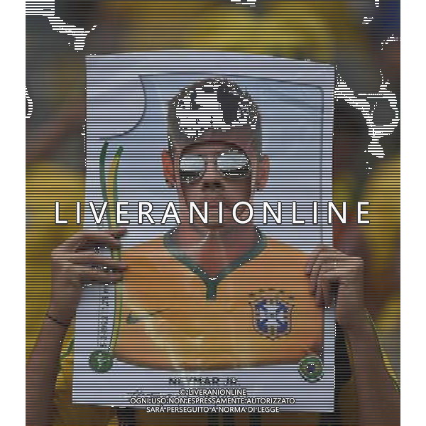 (140708) -- BELO HORIZONTE, July 8, 2014 () -- A Brazil\'s supporter holds a poster of Brazil\'s Neymar before a semifinal match between Brazil and Germany of 2014 FIFA World Cup at the Estadio Mineirao Stadium in Belo Horizonte, Brazil, on July 8, 2014.(/Liu Dawei)(pcy) AG ALDO LIVERANI SAS ONLY ITALY