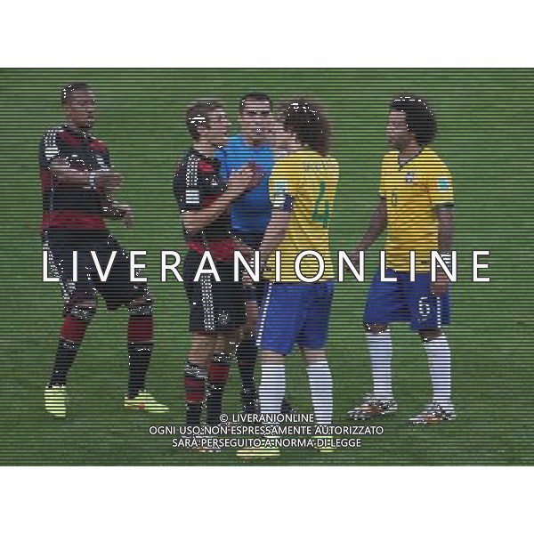 (140708) -- BELO HORIZONTE, July 8, 2014 () -- Mexico\'s referee Marco Rodriguez (C) interrupts an arguement between Brazil\'s David Luiz (2nd R) and Germany\'s Thomas Muller (2nd L) during a semifinal match between Brazil and Germany of 2014 FIFA World Cup at the Estadio Mineirao Stadium in Belo Horizonte, Brazil, on July 8, 2014. Germany won 7-1 over Brazil and qualified for the final on Tuesday. (/Li Ming)(pcy) ©photoshot/Agenzia Aldo Liverani sas - ITALY ONLY - EDITORIAL USE ONLY - BRASILE VS GERMANIA partita di semifinale Coppa del mondo FIFA 2014 Mineirao stadio Estadio a Belo Horizonte, in Brasile, 8 luglio 2014, la Germania ha vinto 7-1 e qualificato per la finale