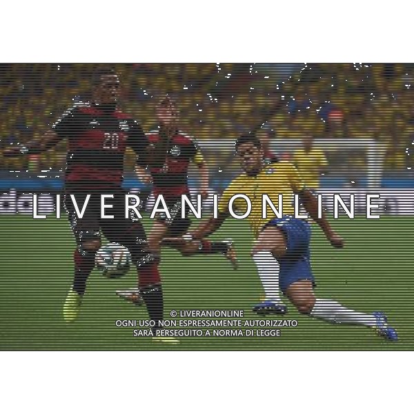 (140708) -- BELO HORIZONTE, July 8, 2014 () -- Germany\'s Jerome Boateng (L) vies with Brazil\'s Hulk during a semifinal match between Brazil and Germany of 2014 FIFA World Cup at the Estadio Mineirao Stadium in Belo Horizonte, Brazil, on July 8, 2014. Germany won 7-1 over Brazil and qualified for the final on Tuesday. (/Li Ga)(pcy) ©photoshot/Agenzia Aldo Liverani sas - ITALY ONLY - EDITORIAL USE ONLY - BRASILE VS GERMANIA partita di semifinale Coppa del mondo FIFA 2014 Mineirao stadio Estadio a Belo Horizonte, in Brasile, 8 luglio 2014, la Germania ha vinto 7-1 e qualificato per la finale