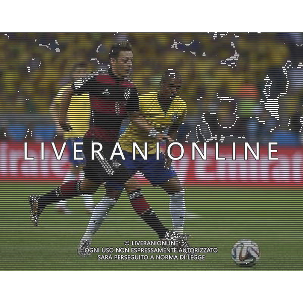 (140708) -- BELO HORIZONTE, July 8, 2014 () -- Germany\'s Mesut Ozil (L) breaks through during a semifinal match between Brazil and Germany of 2014 FIFA World Cup at the Estadio Mineirao Stadium in Belo Horizonte, Brazil, on July 8, 2014. Germany won 7-1 over Brazil and qualified for the final on Tuesday. (/Qi Heng)(pcy) ©photoshot/Agenzia Aldo Liverani sas - ITALY ONLY - EDITORIAL USE ONLY - BRASILE VS GERMANIA partita di semifinale Coppa del mondo FIFA 2014 Mineirao stadio Estadio a Belo Horizonte, in Brasile, 8 luglio 2014, la Germania ha vinto 7-1 e qualificato per la finale