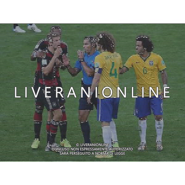(140708) -- BELO HORIZONTE, July 8, 2014 () -- Mexico\'s referee Marco Rodriguez (C) interrupts an arguement between Brazil\'s David Luiz (2nd R) and Germany\'s Thomas Muller (2nd L) during a semifinal match between Brazil and Germany of 2014 FIFA World Cup at the Estadio Mineirao Stadium in Belo Horizonte, Brazil, on July 8, 2014. Germany won 7-1 over Brazil and qualified for the final on Tuesday. (/Li Ming)(pcy) ©photoshot/Agenzia Aldo Liverani sas - ITALY ONLY - EDITORIAL USE ONLY - BRASILE VS GERMANIA partita di semifinale Coppa del mondo FIFA 2014 Mineirao stadio Estadio a Belo Horizonte, in Brasile, 8 luglio 2014, la Germania ha vinto 7-1 e qualificato per la finale